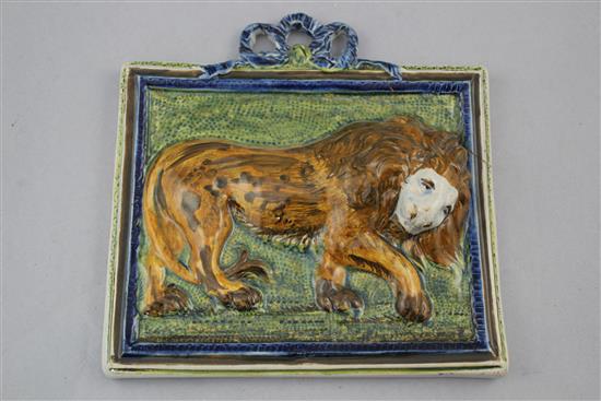 An unusual Pearlware pottery lion plaque, c.1810, 20 x 19.8cm., one corner re-stuck